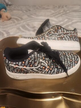 Nike Black & White 'Just Do It' Patterned Kids Sneakers with Orange Accents